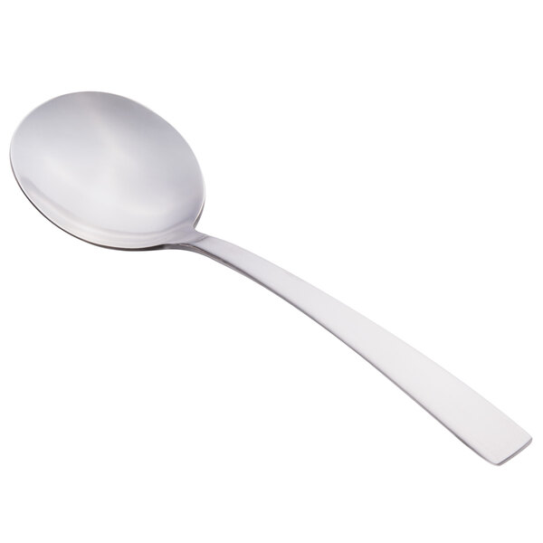 A Libbey stainless steel bouillon spoon with a white handle.