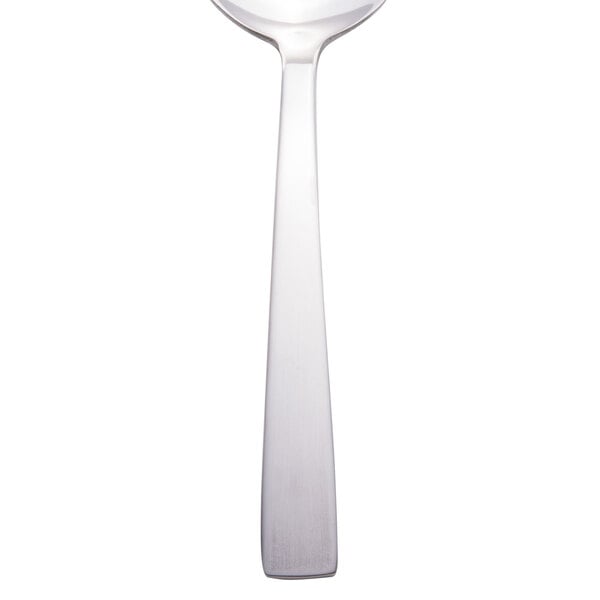 A Libbey stainless steel bouillon spoon with a silver handle.