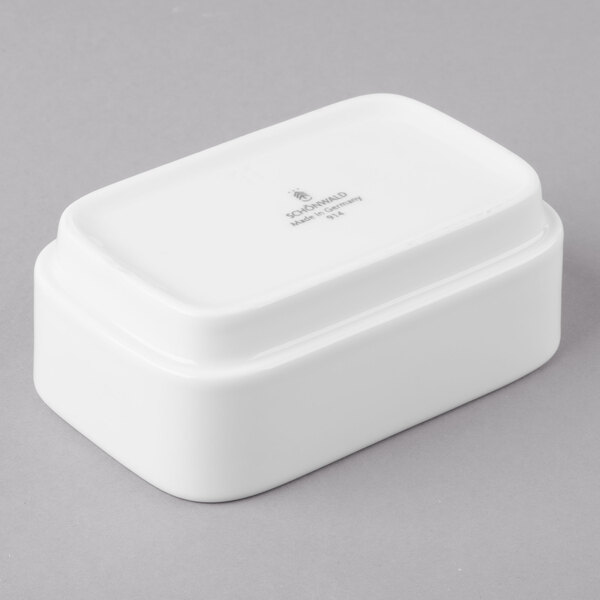 A Schonwald white rectangular porcelain sugar packet holder with a lid.