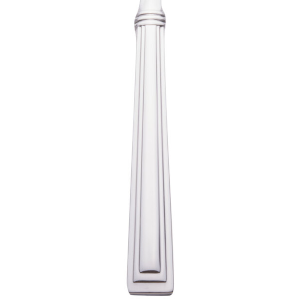 A close-up of a Libbey stainless steel salad fork with a white background.