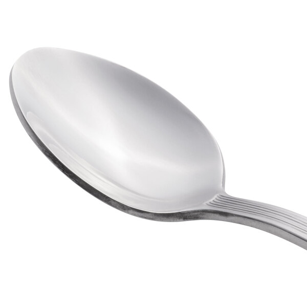 A Libbey stainless steel teaspoon with a silver handle.