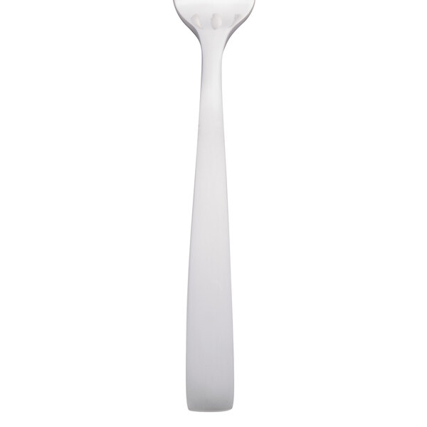 A close-up of a Libbey stainless steel cocktail fork with a white background.