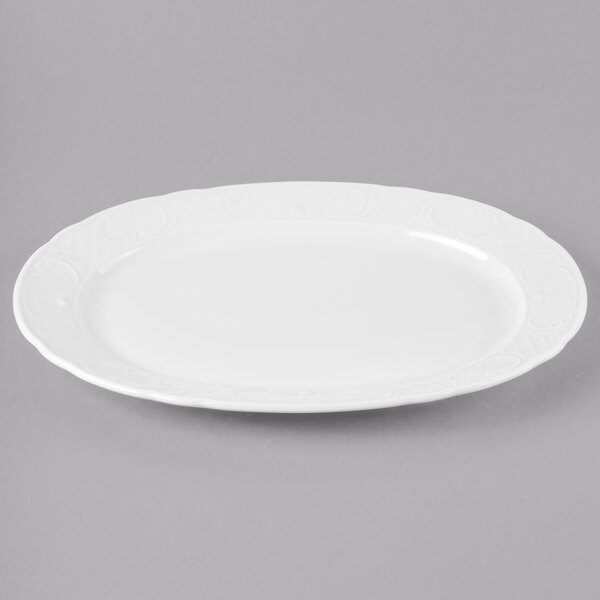 A white Schonwald porcelain oval platter with a decorative design.