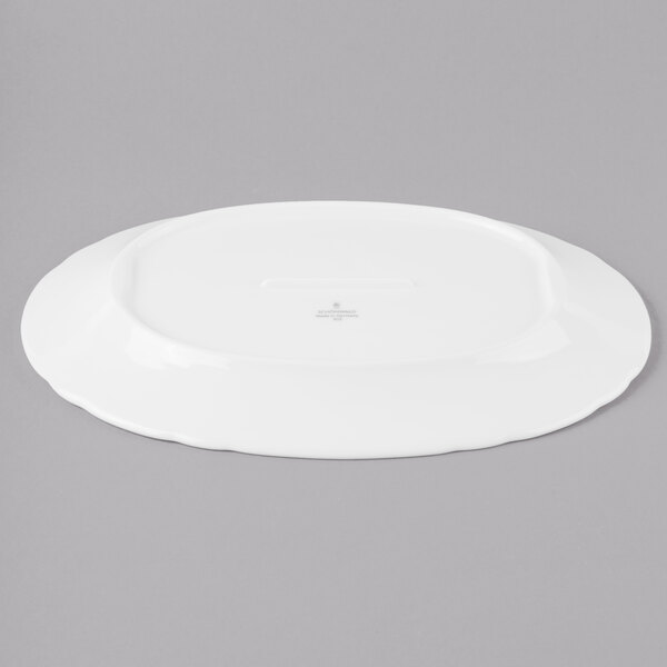 A Schonwald white porcelain oval platter on a gray background.