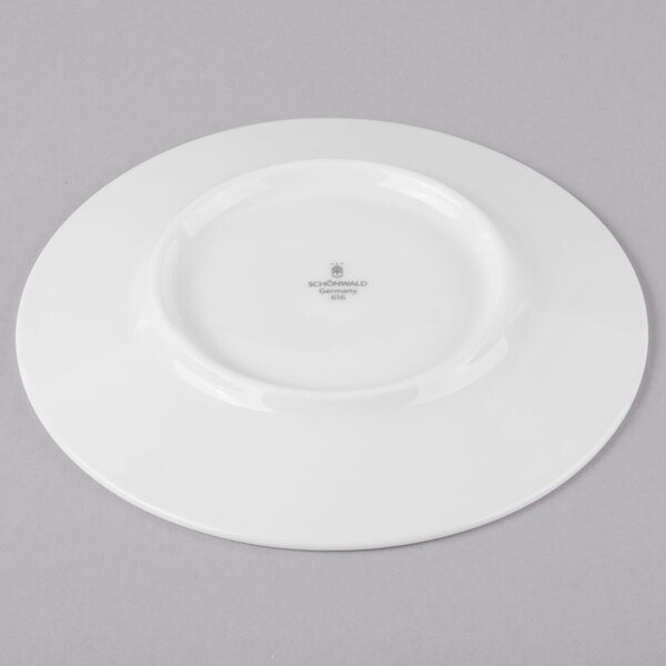 A Schonwald white porcelain saucer with a small white rim.