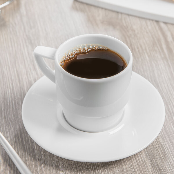A cup of coffee on a Schonwald white porcelain saucer.