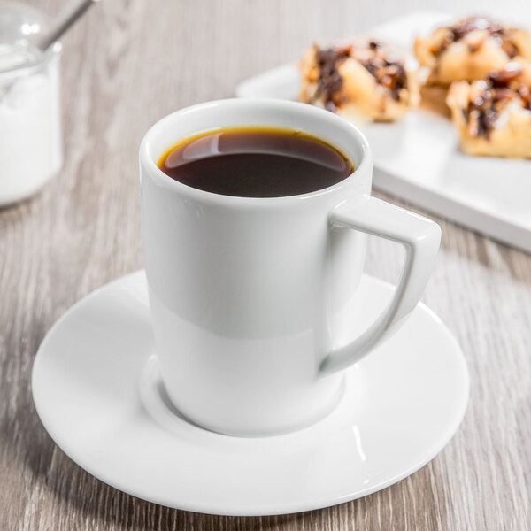 A Schonwald white porcelain saucer with a cup of coffee on it.