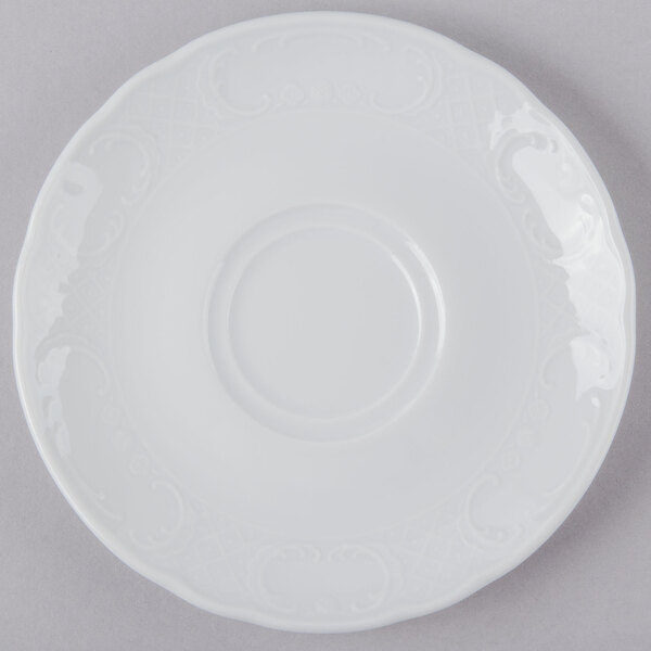 A Schonwald white porcelain saucer with a circular design on it.
