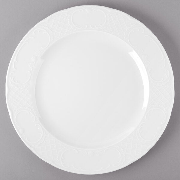 A Schonwald white porcelain plate with a decorative design on it.