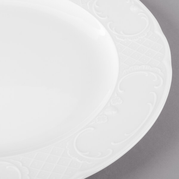 A close up of a Schonwald Marquis white porcelain plate with a decorative design.