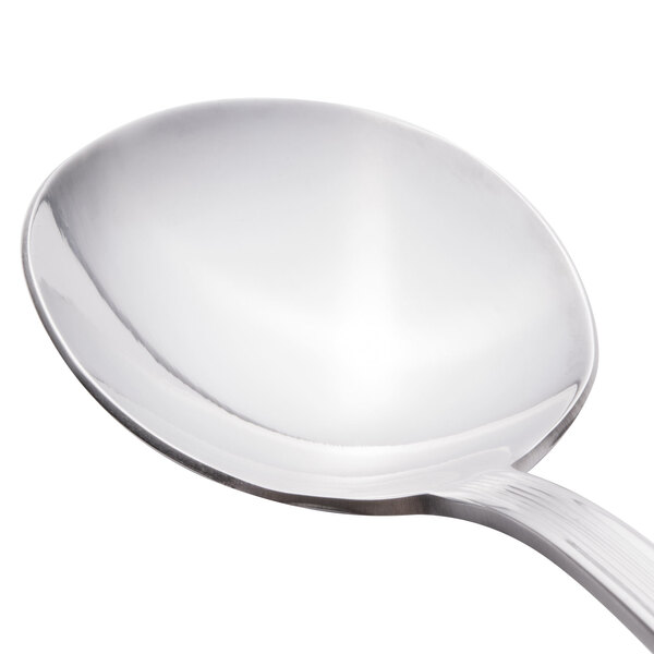 A close-up of a Libbey stainless steel bouillon spoon with a silver handle.