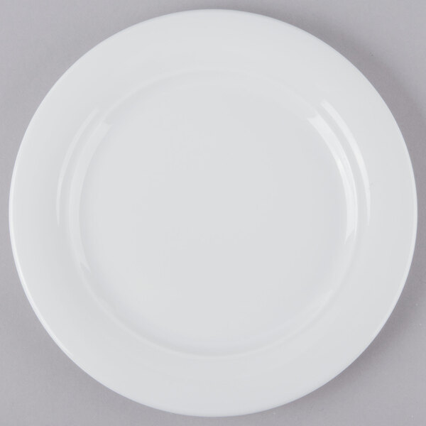 A Schonwald Avanti Gusto white porcelain plate on a gray surface.