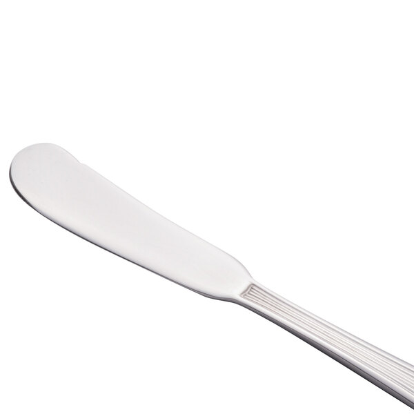 A close-up of a Libbey stainless steel butter spreader with a handle.