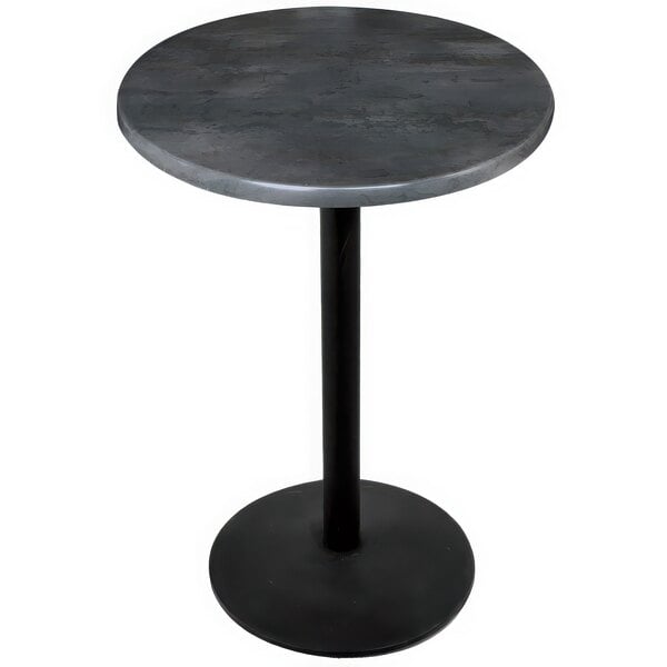 A black round table with a black steel base and a grey top.