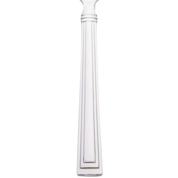 A white column with a black circle containing a Libbey stainless steel teaspoon with a long handle.