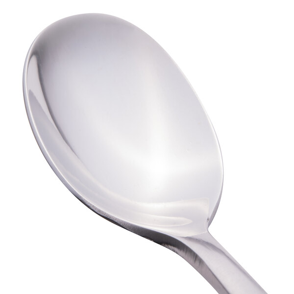 A close-up of a Libbey stainless steel demitasse spoon with a silver handle.