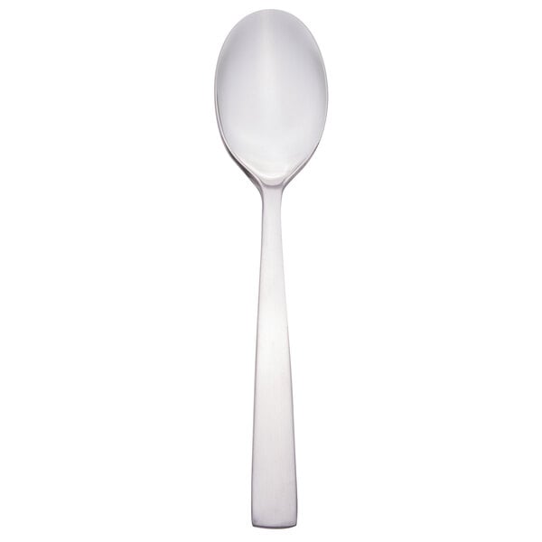 A close-up of a Libbey stainless steel demitasse spoon with a silver handle.