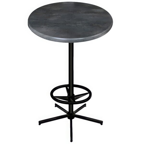 A round black steel table with a metal base.