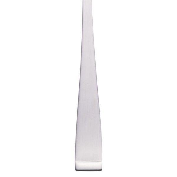A Libbey stainless steel salad fork with a white handle.