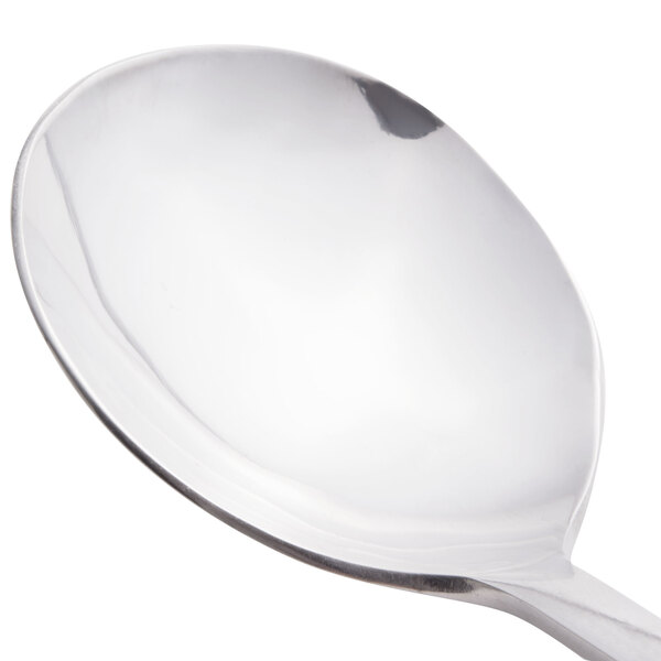 A close-up of a Libbey stainless steel bouillon spoon with a silver handle.