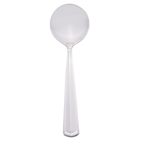 A Libbey stainless steel bouillon spoon with a white handle.