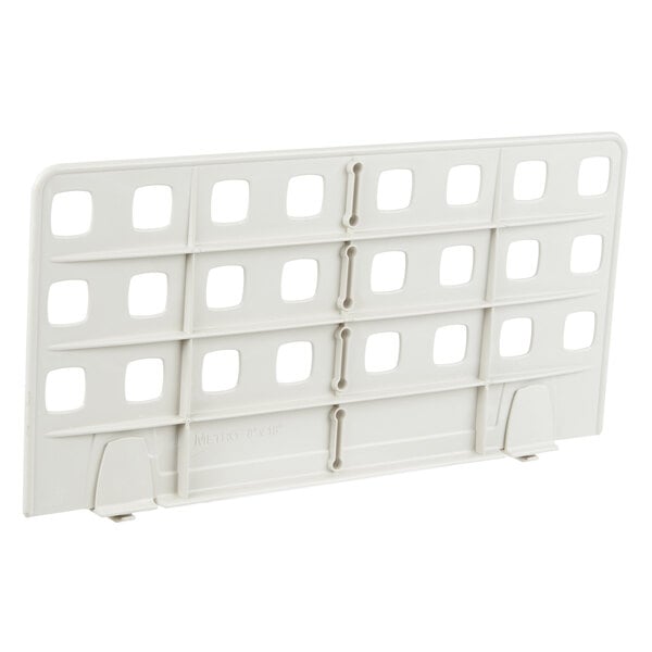 A white plastic MetroMax Q shelf divider with holes.