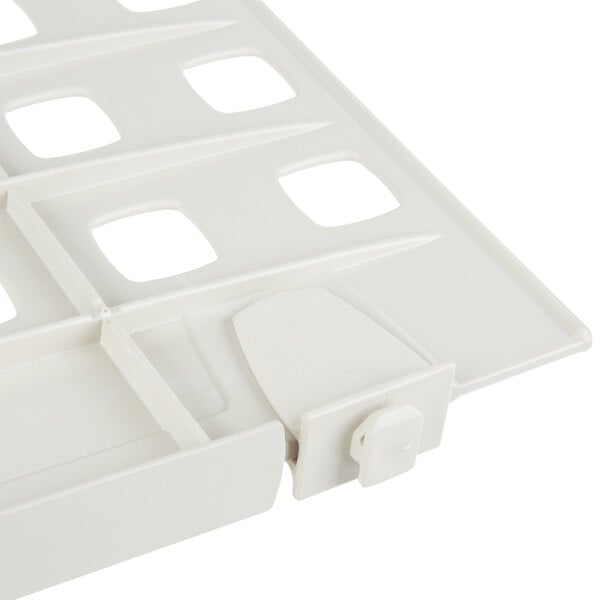 A close-up of a white plastic MetroMax Q shelf divider.
