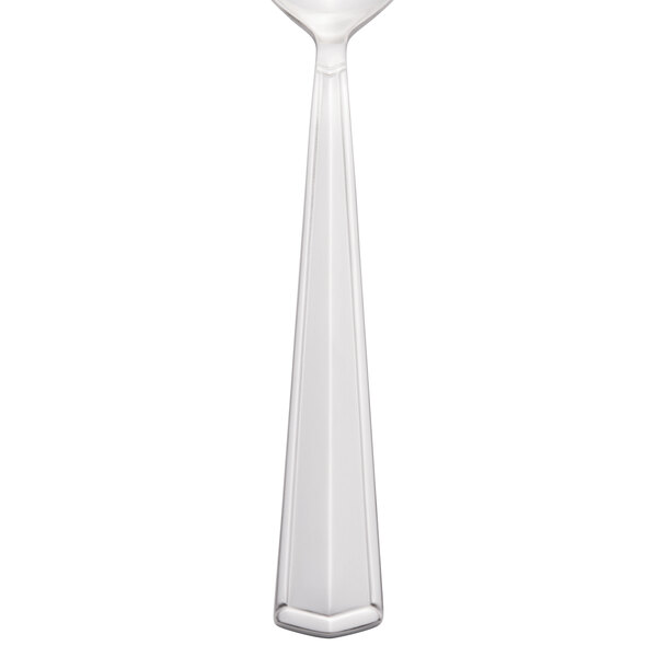 A close-up of a Libbey stainless steel teaspoon with a white background.