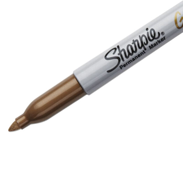 A close-up of a brown Sharpie permanent marker with gold writing.