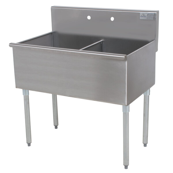 An Advance Tabco stainless steel commercial sink with two compartments on a counter.