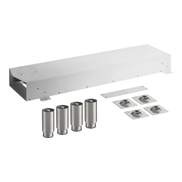 A stainless steel box with metal parts inside including several metal cylinders and plates with holes.