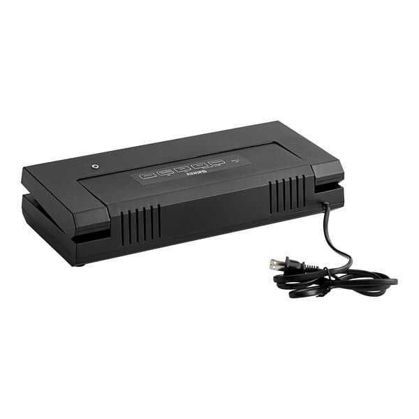 A black Galaxy VME1 external vacuum packaging machine on a counter.