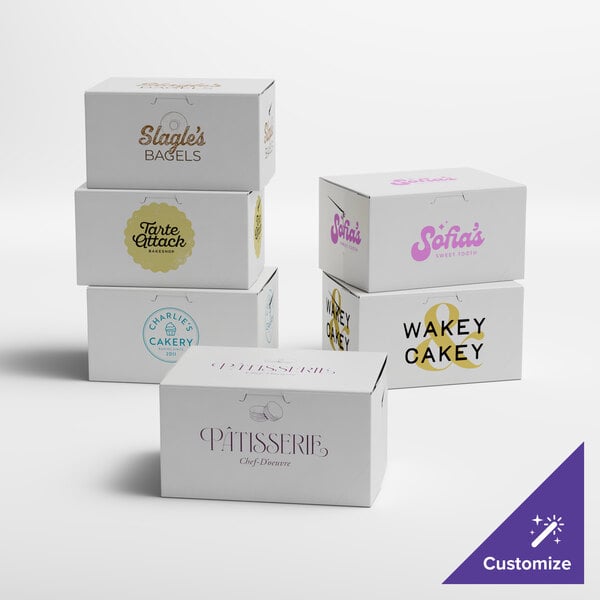 A white customizable cake box with different colored text and logos on it.