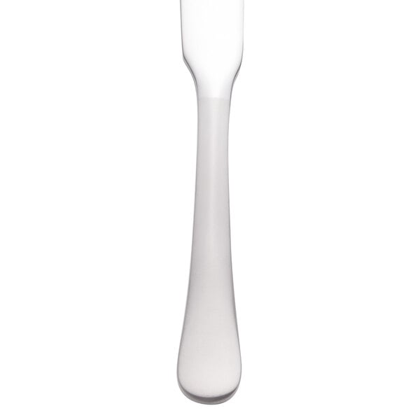 A close-up of a Reserve by Libbey stainless steel butter spreader with a white handle.