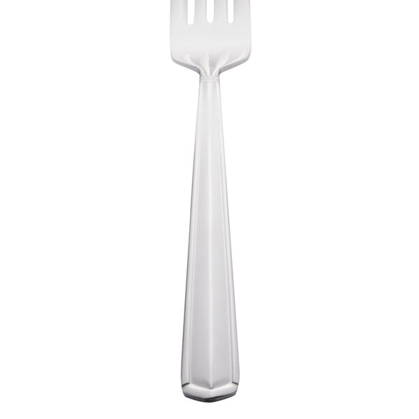 A silver Libbey Vermont salad fork with a white handle.