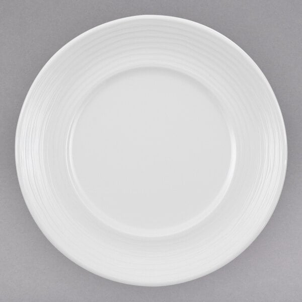 A white Villeroy & Boch porcelain plate with a curved edge.