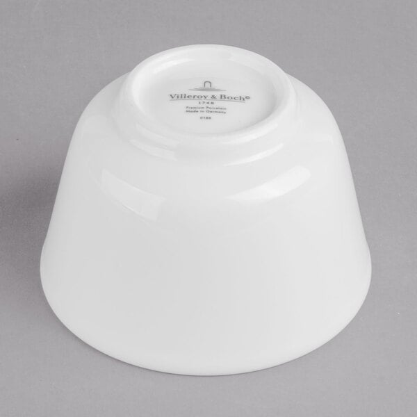 A Villeroy & Boch white porcelain bowl on a gray background.