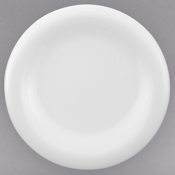 A white Villeroy & Boch Sedona porcelain plate with a rim.