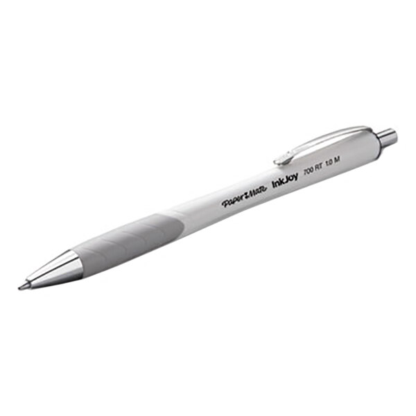 A close-up of a Paper Mate white pen with a gray tip.