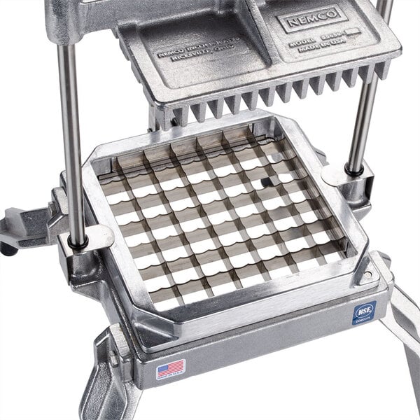 A Nemco square blade and holder assembly for the Easy LettuceKutter with a metal grid.