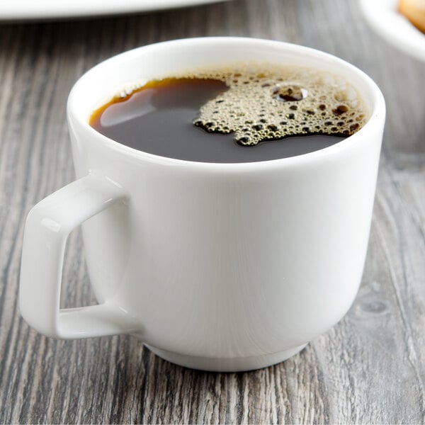 A Villeroy & Boch white porcelain cup of coffee on a table.