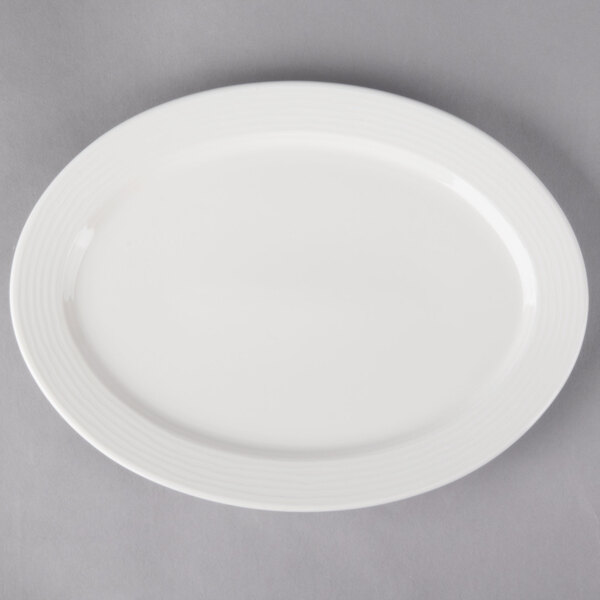 A white Villeroy & Boch Sedona oval plate on a gray background.