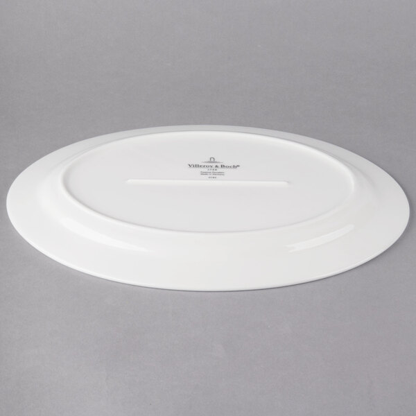 A white Villeroy & Boch porcelain oval plate with a white rim.