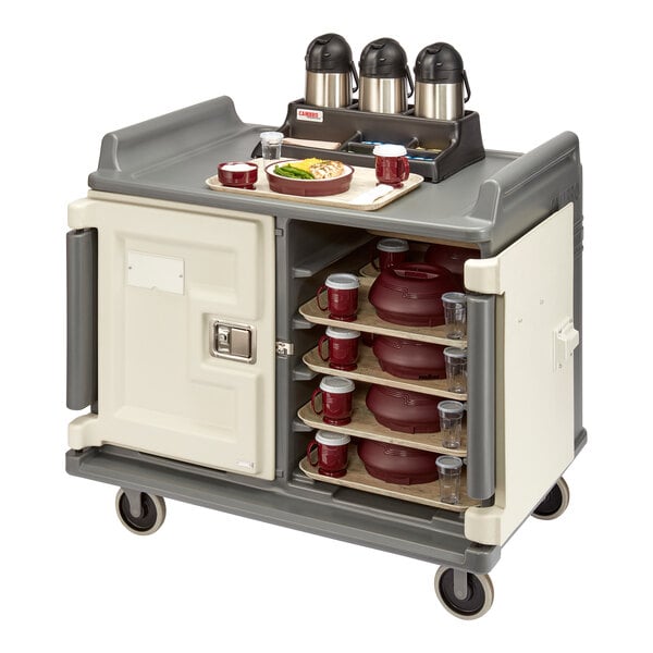A Cambro meal delivery cart with trays and drinks on it.