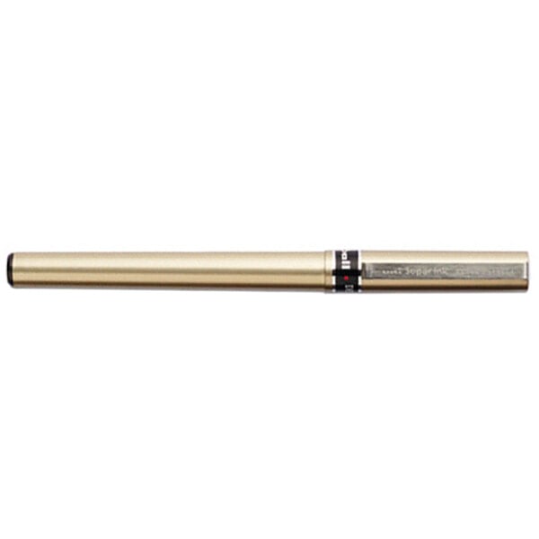 A Uni-Ball Deluxe champagne barrel pen with a black tip and cap.
