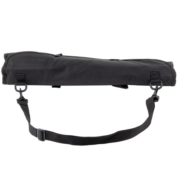 A black bag with a strap holding Dexter-Russell SofGrip cutlery set with white handles.