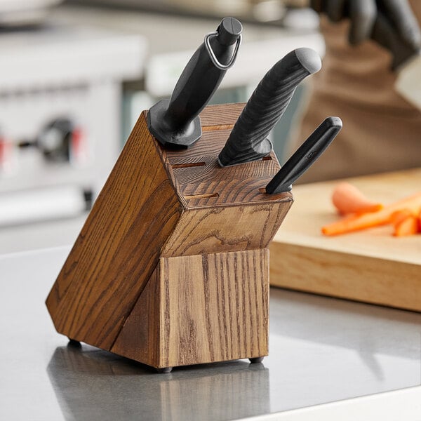 a wooden knife block on a countertop