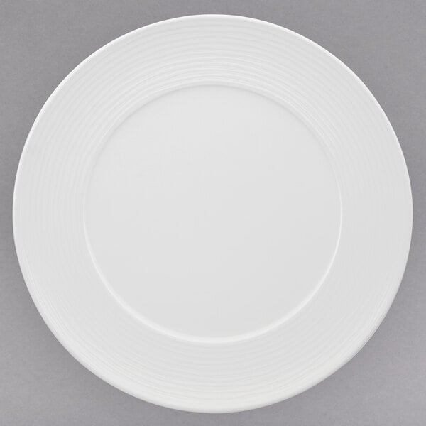 A white Villeroy & Boch porcelain plate with a circular pattern around the rim.