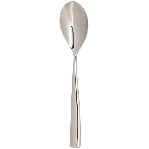 An Arcoroc stainless steel dinner spoon with a long handle.