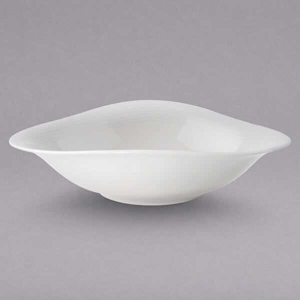 A Villeroy & Boch white porcelain bowl with a curved edge.